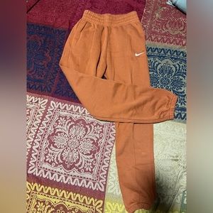 Orange Nike sweatpants